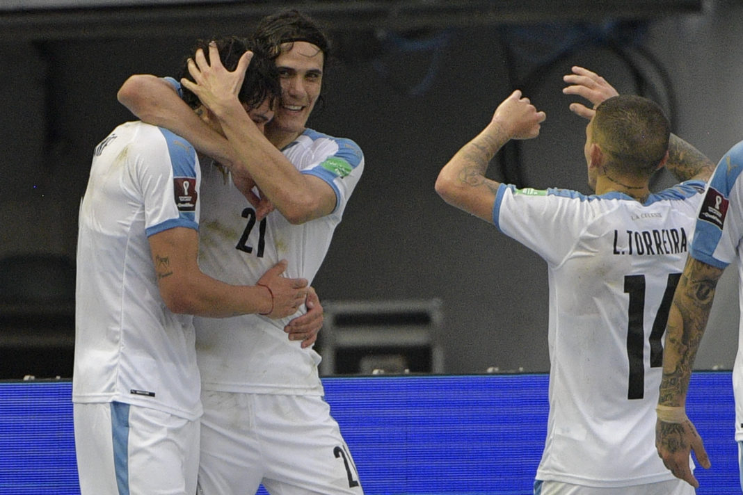 Uruguay's Darwin Nunez (L) celebrates with teammates Uruguay's Edinson Cavani and Lucas Torreira (R) after scoring against Colombia during their closed-door 2022 FIFA World Cup South American qualifier football match at the Metropolitan Stadium in Barranquilla, Colombia, on November 13, 2020. (Photo by RAUL ARBOLEDA/AFP via Getty Images)
