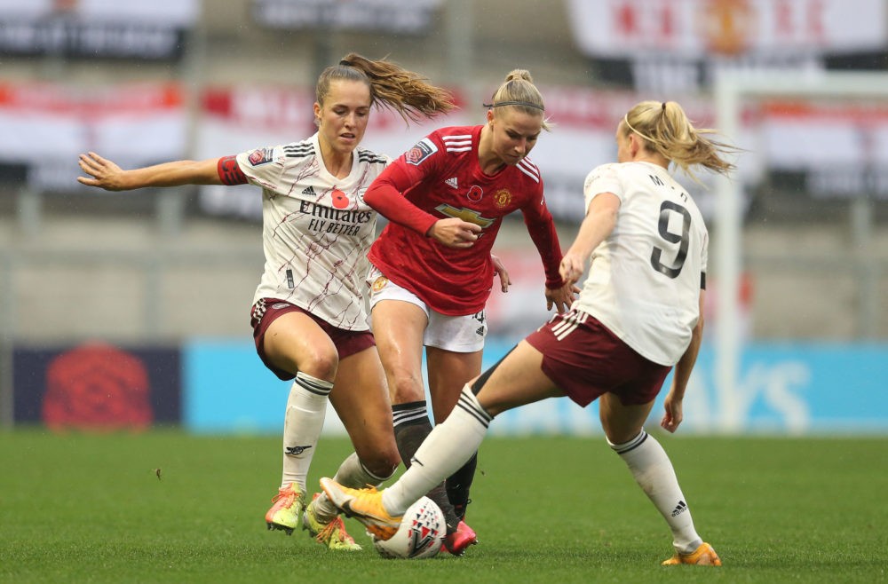 LEIGH, ENGLAND - NOVEMBER 08: Jackie Groenen of Manchester United is challenged by Beth Mead and Lia Walti of Arsenal FC during the Barclays FA Women's Super League match between Manchester United Women and Arsenal Women at Leigh Sports Village on November 08, 2020 in Leigh, England. Sporting stadiums around the UK remain under strict restrictions due to the Coronavirus Pandemic as Government social distancing laws prohibit fans inside venues resulting in games being played behind closed doors. (Photo by Charlotte Tattersall/Getty Images)