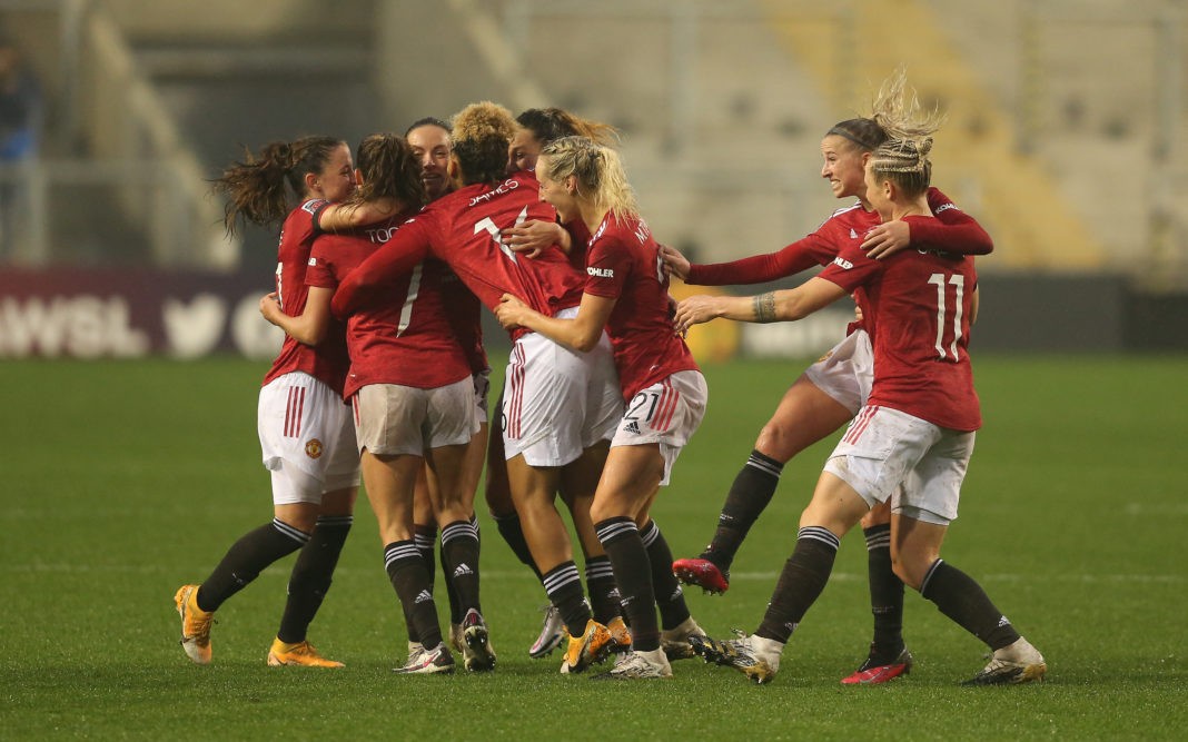 LEIGH, ENGLAND - NOVEMBER 08: Ella Toone of Manchester United celebrates with teammates after scoring her team's first goal during the Barclays FA Women's Super League match between Manchester United Women and Arsenal Women at Leigh Sports Village on November 08, 2020 in Leigh, England. Sporting stadiums around the UK remain under strict restrictions due to the Coronavirus Pandemic as Government social distancing laws prohibit fans inside venues resulting in games being played behind closed doors. (Photo by Charlotte Tattersall/Getty Images)