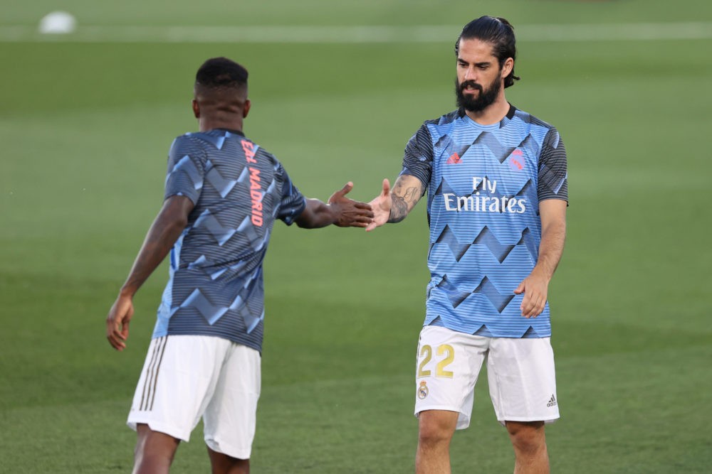 MADRID, SPAIN - JULY 02: Isco (R) and Vinicius Junior of Real Madrid warm up for the Liga match between Real Madrid CF and Getafe CF at Estadio Alfredo Di Stefano on July 02, 2020 in Madrid, Spain. Football Stadiums around Europe remain empty due to the Coronavirus Pandemic as Government social distancing laws prohibit fans inside venues resulting in all fixtures being played behind closed doors. (Photo by Angel Martinez/Getty Images)