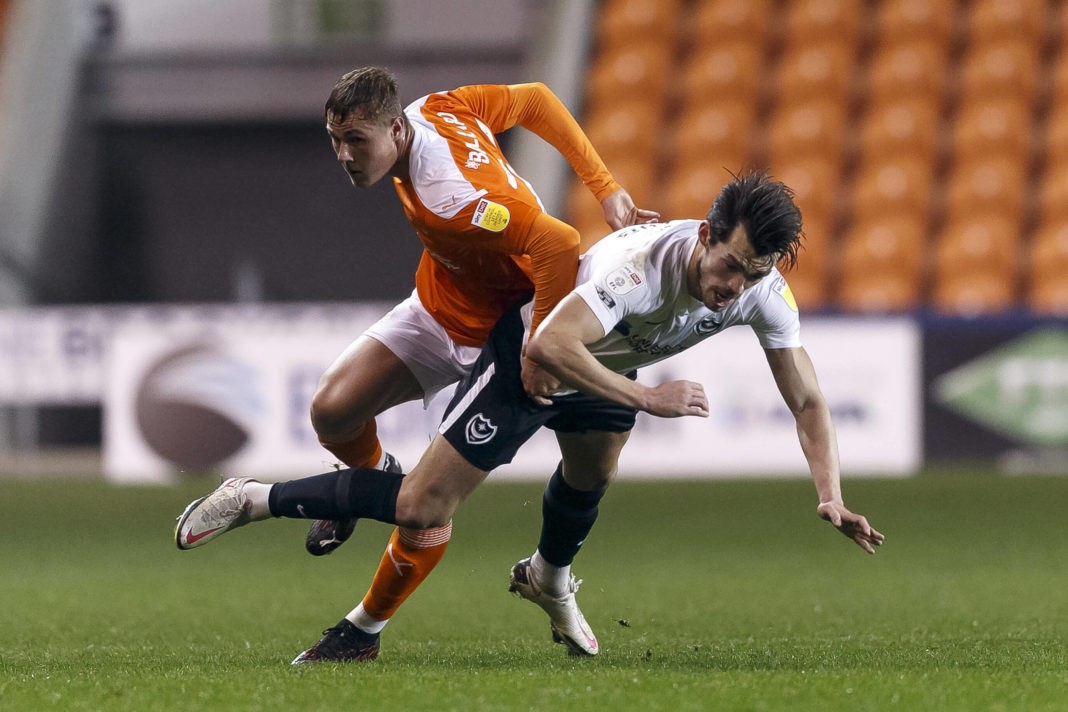 John Marquis of Portsmouth and Daniel Ballard of Blackpool grapple during the Sky Bet League One match between Blackpool and Portsmouth at Bloomfield Road on December 1st 2020 in Blackpool, England. Credit: Daniel / phcimages