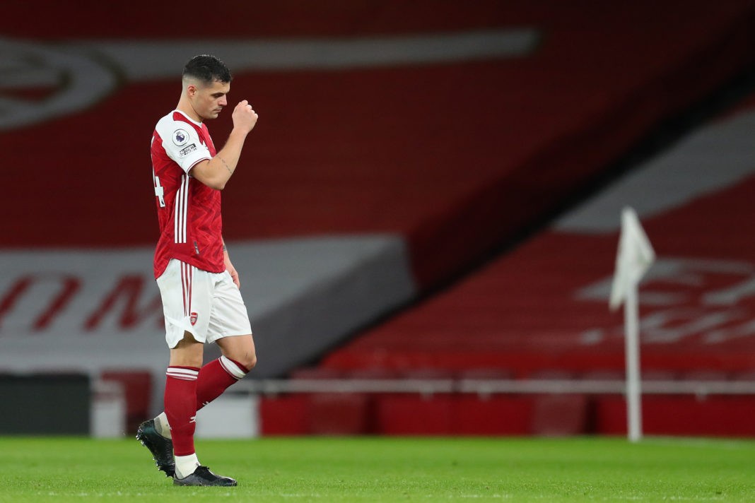 LONDON, ENGLAND - DECEMBER 13: Granit Xhaka of Arsenal looks dejected as he leaves the pitch after being shown a red card during the Premier League match between Arsenal and Burnley at Emirates Stadium on December 13, 2020 in London, England. A limited number of spectators (2000) are welcomed back to stadiums to watch elite football across England. This was following easing of restrictions on spectators in tiers one and two areas only. (Photo by Catherine Ivill/Getty Images )