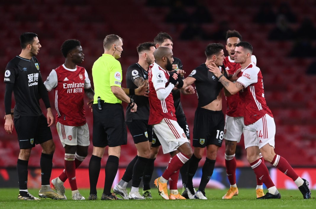 LONDON, ENGLAND - DECEMBER 13: Granit Xhaka of Arsenal grabs Ashley Westwood of Burnley round the throat and is subsequently shown a red card and sent off after a VAR check during the Premier League match between Arsenal and Burnley at Emirates Stadium on December 13, 2020 (Photo by Laurence Griffiths/Getty Images)