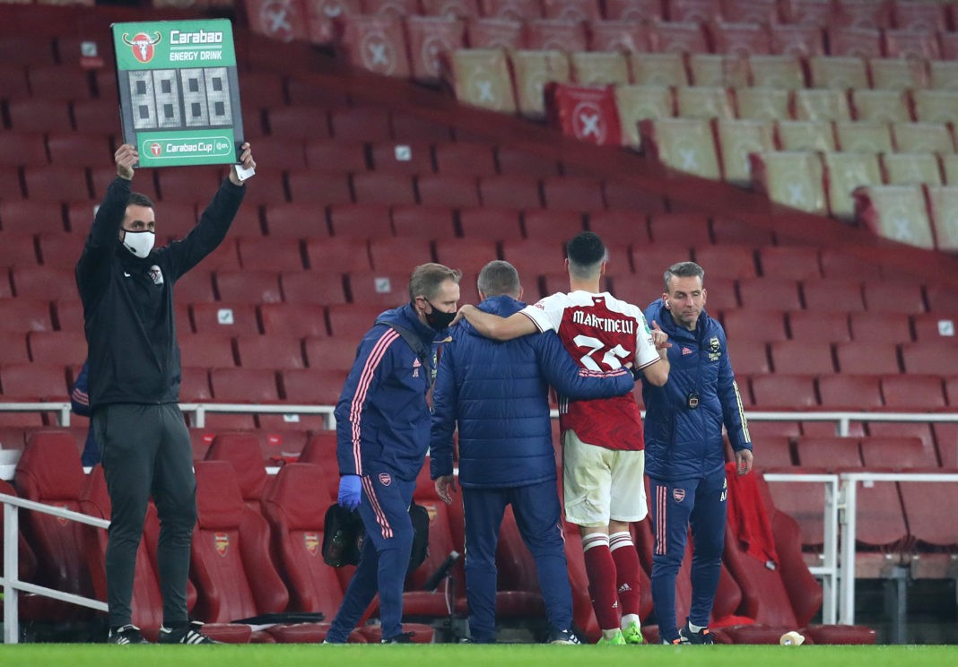 LONDON, ENGLAND - DECEMBER 22: Gabriel Martinelli of Arsenal is helped off as he replaced due to injury during the Carabao Cup Quarter Final match between Arsenal and Manchester City at Emirates Stadium on December 22, 2020 in London, England. The match will be played without fans, behind closed doors as a Covid-19 precaution. (Photo by Catherine Ivill/Getty Images)