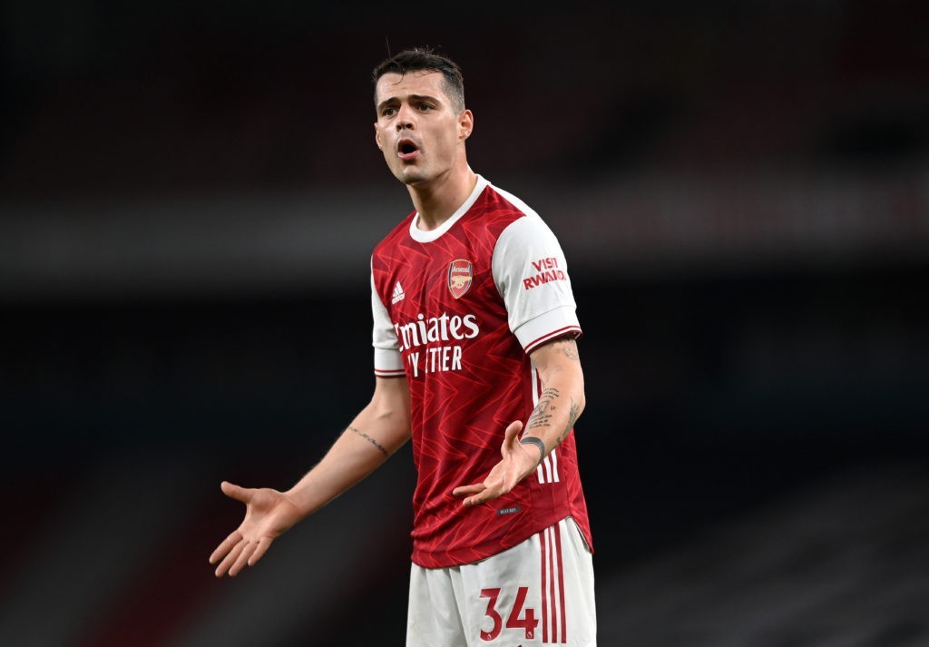 LONDON, ENGLAND - FEBRUARY 21: Granit Xhaka of Arsenal reacts during the Premier League match between Arsenal and Manchester City at Emirates Stadium on February 21, 2021 in London, England. Sporting stadiums around the UK remain under strict restrictions due to the Coronavirus Pandemic as Government social distancing laws prohibit fans inside venues resulting in games being played behind closed doors. (Photo by Shaun Botterill/Getty Images)