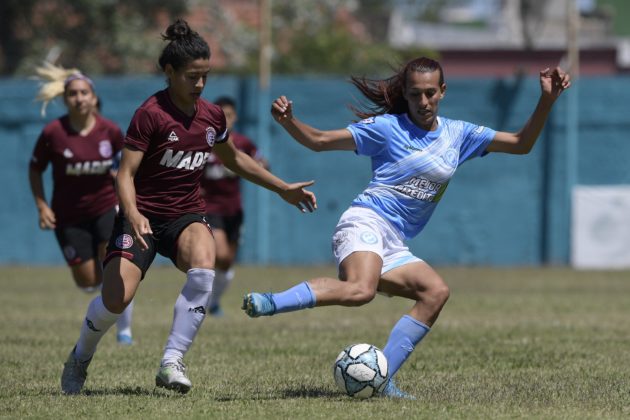 Argentine transgender footballer Mara Gomez (R) of Villa San Carlos vies for the ball with Luciana Nievas of Lanus during an Argentina first division female football match at Genacio Salice stadium in Berisso, Buenos Aires, Argentina on December 7, 2020. - Gomez is the first transgender footballer to play in the first division of the Argentine female league. (Photo by JUAN MABROMATA / AFP)