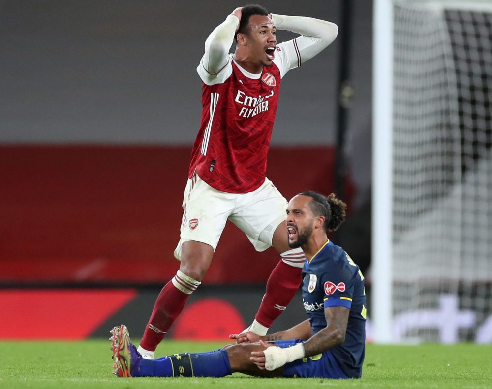 Arsenal's Brazilian defender Gabriel (L) reacts as he realises he is about to receive a red card from Referee Paul Tierney for his foul on Southampton's English midfielder Theo Walcott(R) during the English Premier League football match between Arsenal and Southampton at the Emirates Stadium in London on December 16, 2020. (Photo by PETER CZIBORRA / POOL / AFP)