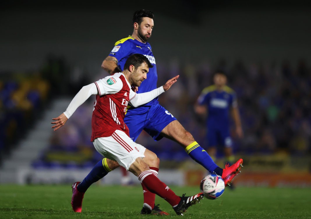 WIMBLEDON, ENGLAND: Sokratis Papastathopoulos of Arsenal is blocked by Ollie Palmer of AFC Wimbledon during the Papa John's Trophy Second Round match between AFC Wimbledon and Arsenal U21 at Plough Lane on December 08, 2020. (Photo by James Chance/Getty Images)