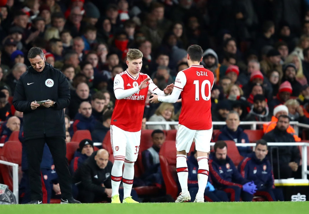 LONDON, ENGLAND - DECEMBER 15: Emile Smith Rowe of Arsenal comes on for Mesut Ozil of Arsenal during the Premier League match between Arsenal FC and Manchester City at Emirates Stadium on December 15, 2019 in London, United Kingdom. (Photo by Julian Finney/Getty Images)