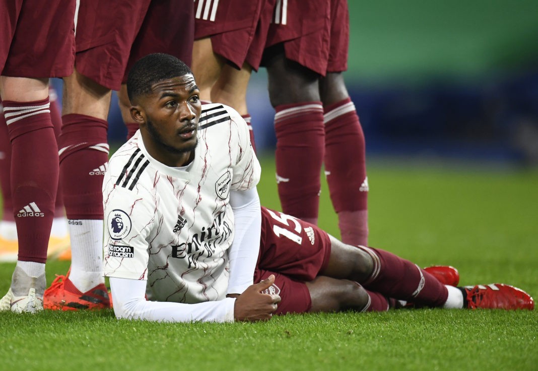 LIVERPOOL, ENGLAND - DECEMBER 19: Ainsley Maitland-Niles of Arsenal lies on the ground as he sets up to defend a free kick during the Premier League match between Everton and Arsenal at Goodison Park on December 19, 2020 in Liverpool, England. A limited number of fans (2000) are welcomed back to stadiums to watch elite football across England. This was following easing of restrictions on spectators in tiers one and two areas only. (Photo by Peter Powell -