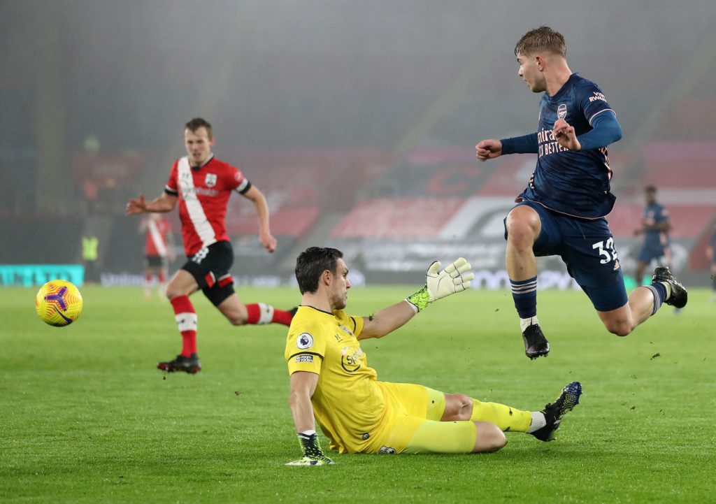 Arsenal's English midfielder Emile Smith Rowe (R) shoots during the English Premier League football match between Southampton and Arsenal at St Mary's Stadium in Southampton, southern England. (Photo by NAOMI BAKER/POOL/AFP via Getty Images)