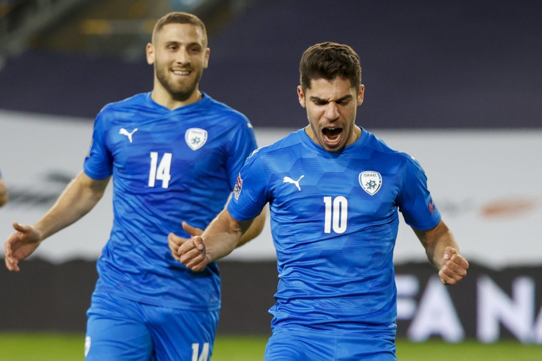 Israel's forward Manor Solomon (R) celebrates after scoring during the UEFA Nations League B Group 2 football match between Israel and Scotland at the Netanya Municipal Stadium in the Israeli city on November 18, 2020. (Photo by JACK GUEZ / AFP)