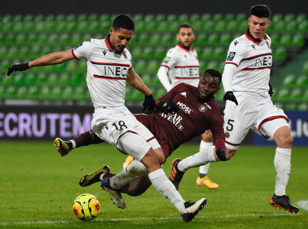 Nice's French defender William Saliba (L) is challenged by Metz's French forward Thierry Ambrose during the French L1 football match between Football Club de Metz and OGC Nice at the Saint-Symphorien Stadium in Longeville-Les-Metz, eastern France on January 9, 2021. (Photo by JEAN-CHRISTOPHE VERHAEGEN/AFP via Getty Images)