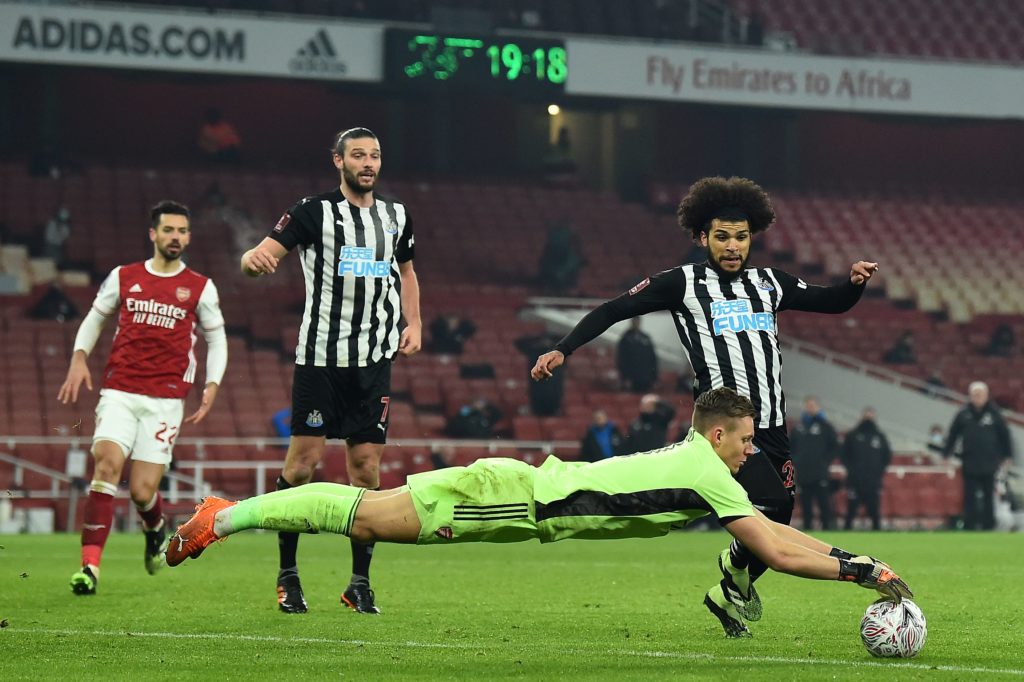 Arsenal's German goalkeeper Bernd Leno saves at the feet of Newcastle United's US defender DeAndre Yedlin (R) during the English FA Cup third round football match between Arsenal and Newcastle United at the Emirates Stadium in London on January 9, 2021. (Photo by Glyn KIRK / AFP)