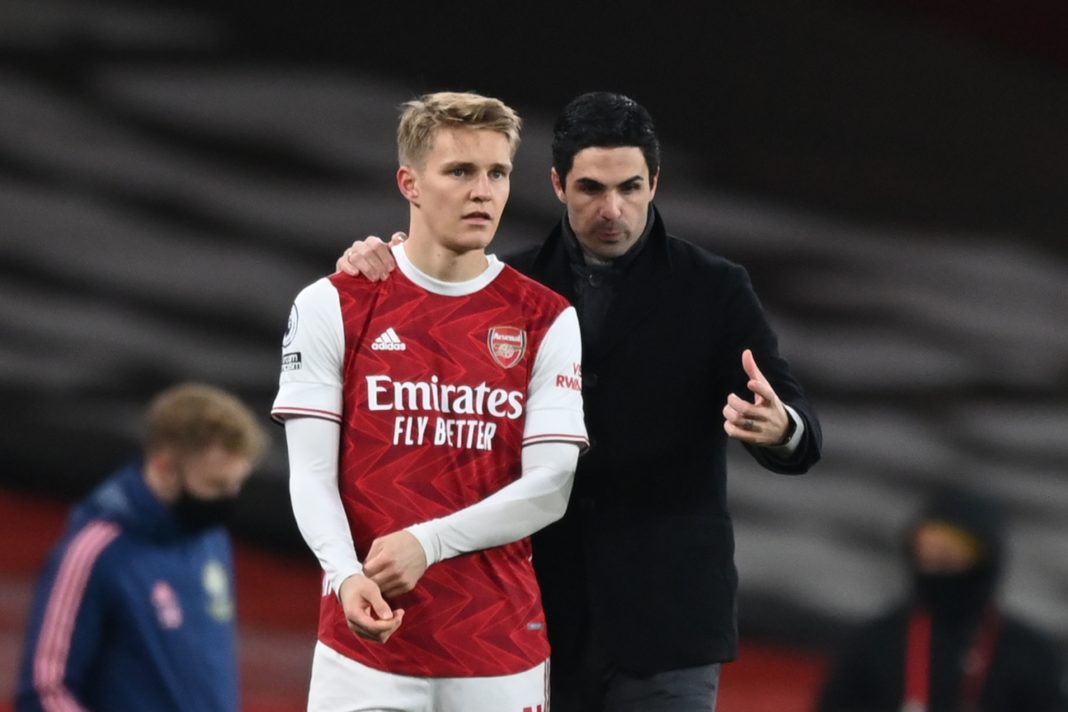 Arsenal deals: Arsenal's Norwegian midfielder Martin Odegaard (L) gets instructions from Arsenal's Spanish manager Mikel Arteta (R) as he comes on as a substitute during the English Premier League football match between Arsenal and Manchester United at the Emirates Stadium in London on January 30, 2021. (Photo by Shaun Botterill / POOL / AFP)