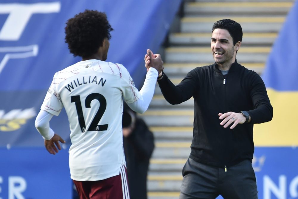 Arsenal's Spanish manager Mikel Arteta (R) celebrates with Arsenal's Brazilian midfielder Willian (L) on the pitch after the English Premier League football match between Leicester City and Arsenal at King Power Stadium in Leicester, central England on February 28, 2021. - Arsenal won the game 3-1. (Photo by Rui Vieira / POOL / AFP)