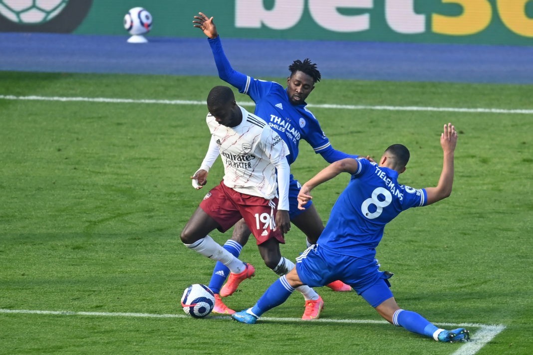 Arsenal's French-born Ivorian midfielder Nicolas Pepe is fouled, just outside the penalty area after a VAR (Video Assistant Referee) review during the English Premier League football match between Leicester City and Arsenal at King Power Stadium in Leicester, central England on February 28, 2021. (Photo by Michael Regan / POOL / AFP)