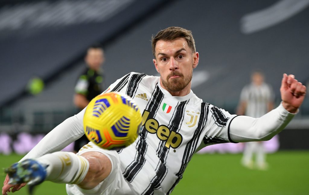 Juventus' Welsh midfielder Aaron Ramsey shots the ball during the Italian Cup quarter final football match between Juventus and Spal on January 27, 2021 at the Allkianz stadium in Turin. (Photo by Isabella BONOTTO / AFP)