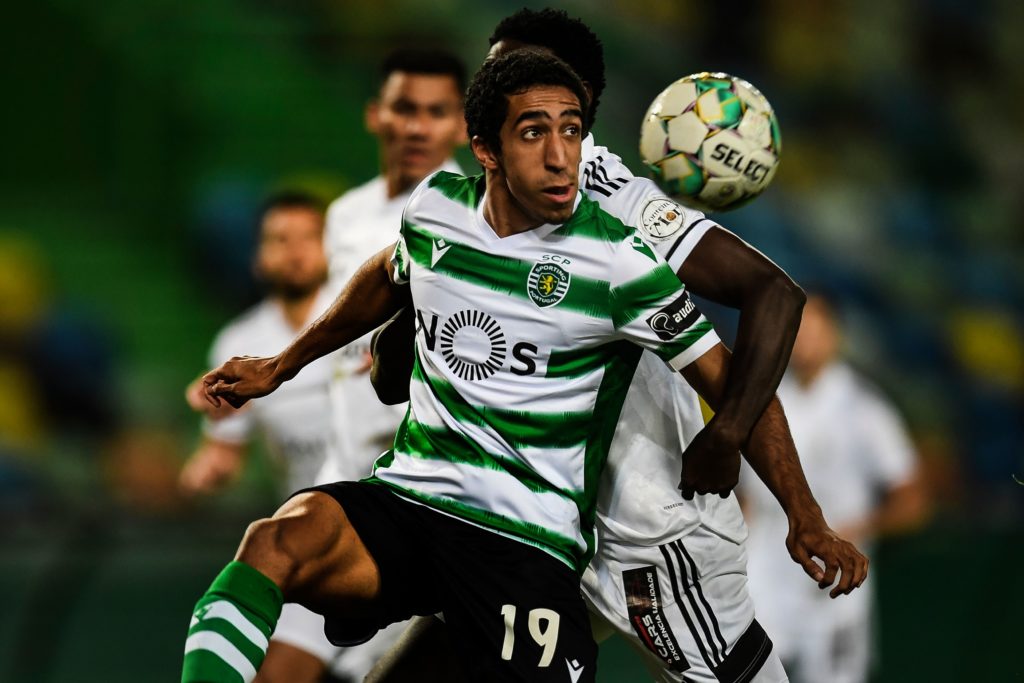 Sporting's Portuguese forward Tiago Tomas (L) vies with Farense's Bissau Ginean defender Bura (R) during the Portuguese league football match between Sporting CP and SC Farense at the Jose Alvalade stadium in Lisbon on December 19, 2020. (Photo by PATRICIA DE MELO MOREIRA/AFP via Getty Images)