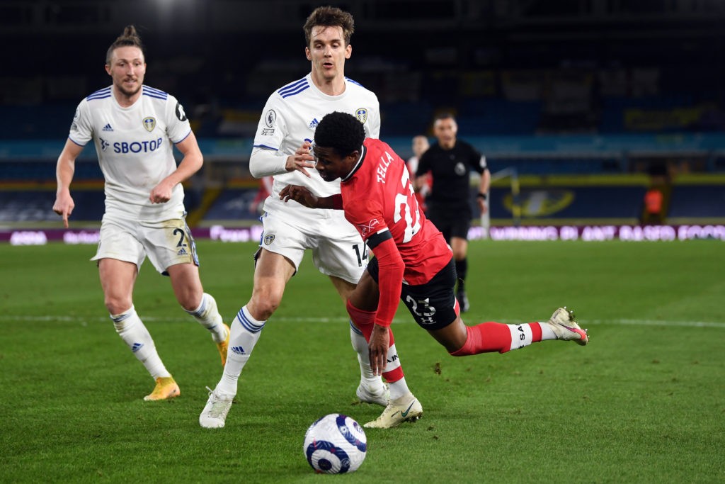 LEEDS, ENGLAND: Nathan Tella of Southampton is fouled by Diego Llorente of Leeds United, leading to a penalty which is later overturned by VAR during the Premier League match between Leeds United and Southampton at Elland Road on February 23, 2021. (Photo by Gareth Copley/Getty Images)