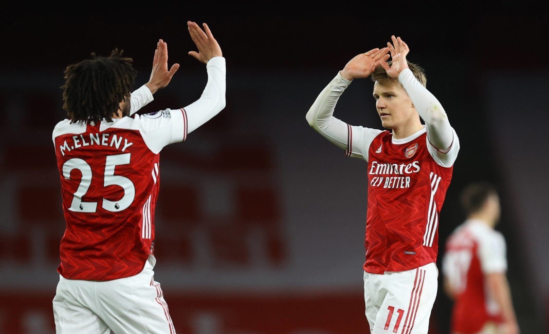 Arsenal v Tottenham Hotspur - Premier League - Emirates Stadium Arsenal s Mohamed Elneny and Martin Odegaard celebrate after the Premier League match at Emirates Stadium, London. Picture date: Sunday March 14, 2021. Copyright: Julian Finney