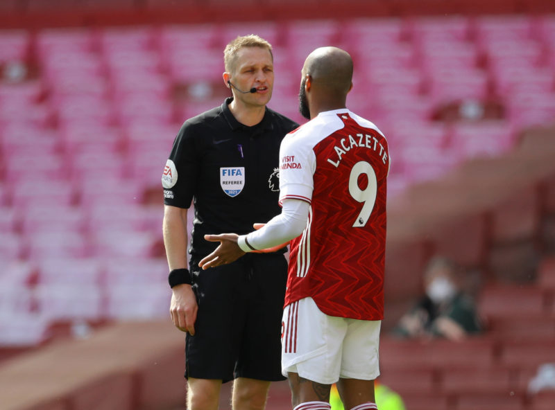 London, England, 18th April 2021. Referee Craig Pawson talks to Alexandre Lacazette of Arsenal during the Premier League match at the Emirates Stadium, London. Picture credit: David Klein / Sportimage 