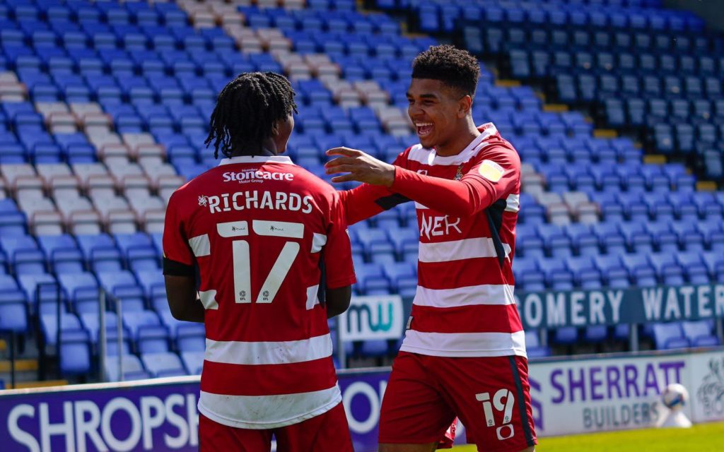 Tyreece John-Jules celebrates a goal with Doncaster Rovers teammate Taylor Richards (Photo via John-Jules on Twitter)