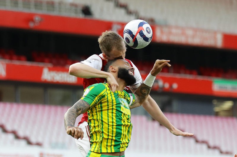London, England, 9th May 2021. Rob Holding of Arsenal challenges Kyle Bartley of West Bromwich Albion during the Premier League match at the Emirates Stadium, London. Picture credit: David Klein / Sportimage