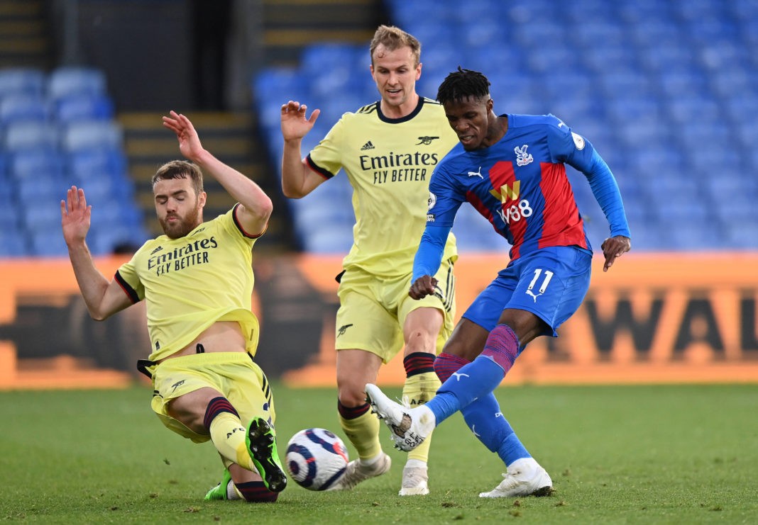Arsenal's Calum Chambers (left) blocks the shot from Crystal Palace's Wilfried Zaha during the Premier League match at Selhurst Park, London. Picture date: Wednesday, May 19, 2021. Copyright: Justin Setterfield