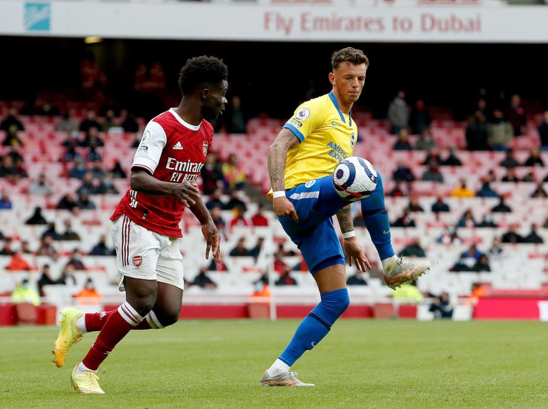Ben White of Brighton and Hove Albion controls the ball watched by Bukayo Saka of Arsenal - 23/05/2021. Copyright: Matt Impey / Shutterstock