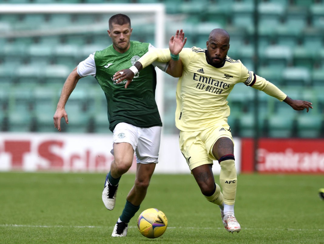 Hibernian v Arsenal - Pre Season Friendly - Easter Road Arsenal s Alexandre Lacazette right and Hiberninan s Alex Gogic battle for the ball during the pre-season match at Easter Road, Edinburgh. Picture date: Tuesday July 13, 2021. Copyright: Ian Rutherford
