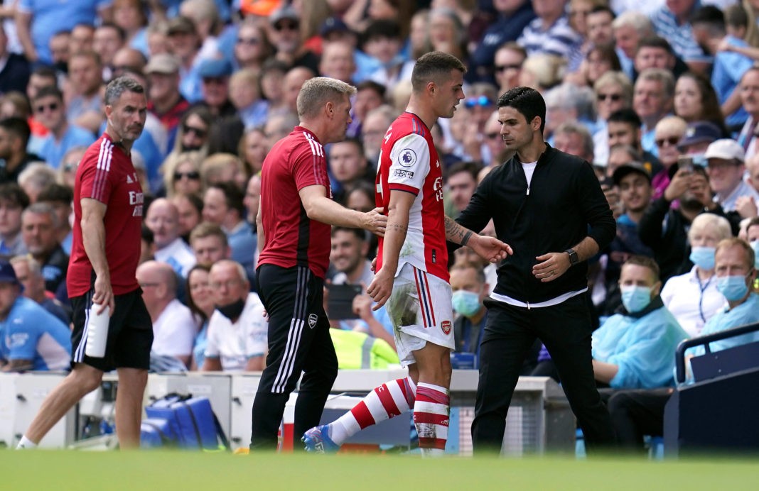 Manchester City v Arsenal - Premier League - Etihad Stadium Arsenals Granit Xhaka walks past manager Mikel Arteta after being sent off during the Premier League match at the Etihad Stadium, Manchester. Picture date: Saturday August 28, 2021. Copyright: Nick Potts
