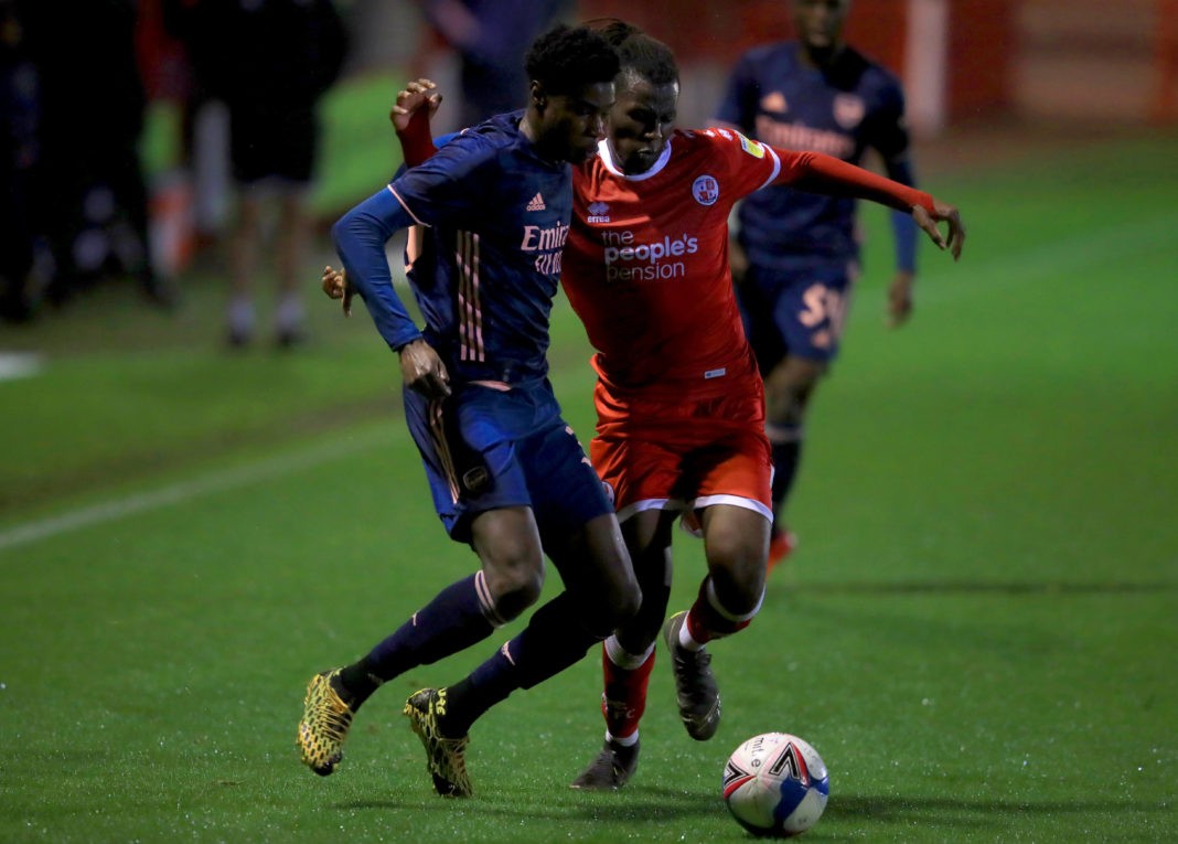 Arsenal U21's Ryan Alebiosu (left) and Crawley Town's David Sesay battle for the ball during the EFL Trophy Southern Group B match at The People's Pension Stadium, Crawley. Copyright: Adam Davy