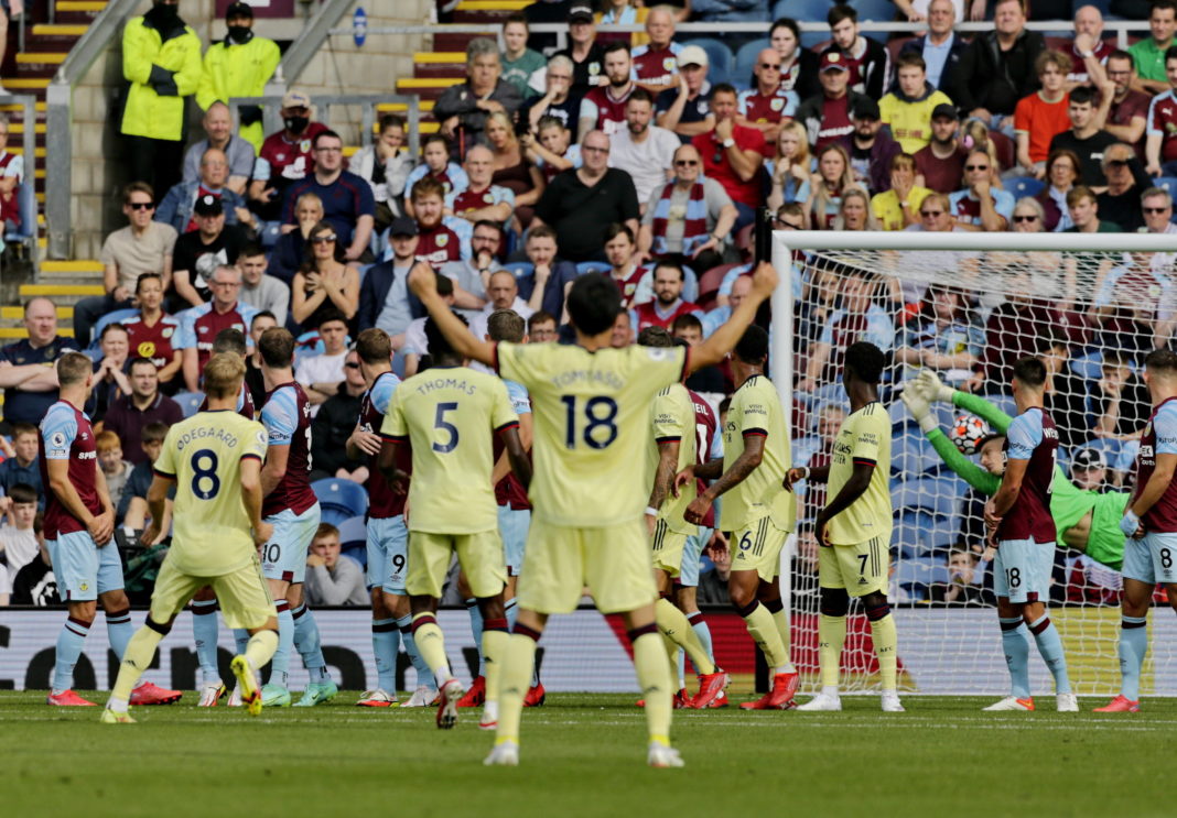 Football - 2021 / 2022 Premier League - Burnley vs. Arsenal Martin Odegaard of Arsenal curls a free kick around the Burnley wall to put his team 1-0 ahead in the first half, at Turf Moor. COLORSPORT/ALAN MARTIN