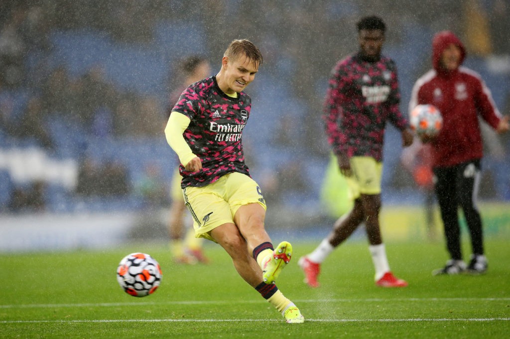 BRIGHTON, ENGLAND - OCTOBER 02: Martin Odegaard of Arsenal shoots during the warm up prior to the Premier League match between Brighton & Hove Albion and Arsenal at American Express Community Stadium on October 02, 2021 in Brighton, England. (Photo by Steve Bardens/Getty Images)
