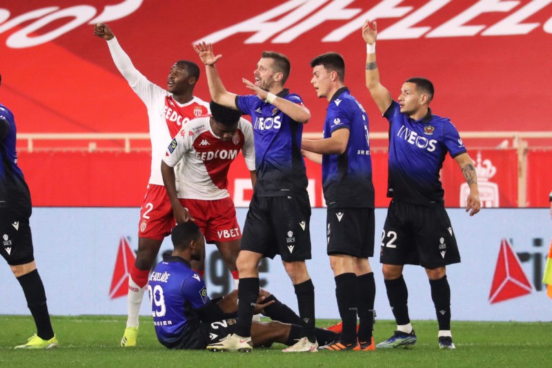 Nice's French midfielder Jeff Reine-Adelaide (down) reacts after an injury during the French L1 football match between AS Monaco and OGC Nice at the "Louis II Stadium" in Monaco on February 3, 2021. (Photo by Valery HACHE / AFP) (Photo by VALERY HACHE/AFP via Getty Images)