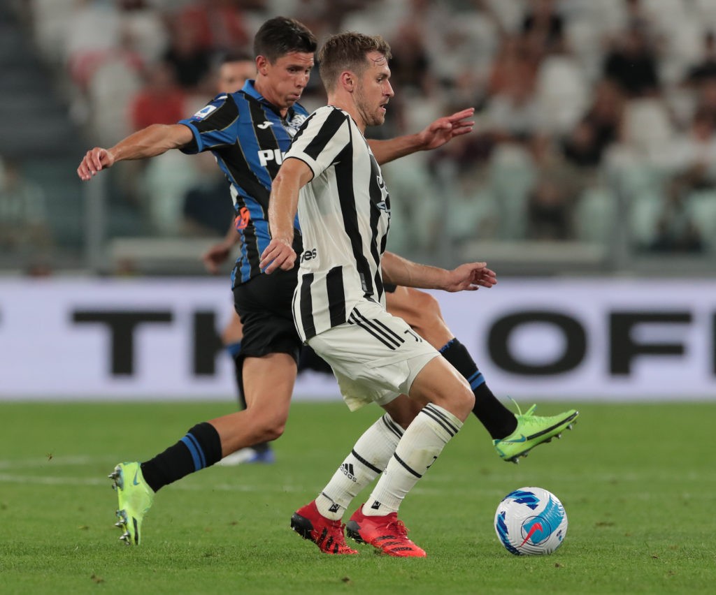 TURIN, ITALY - AUGUST 14: Aaron Ramsey of Juventus is challenged by Matteo Pessina of Atalanta BC during the pre-season friendly match between Juventus and Atalanta BC at Allianz Stadium on August 14, 2021 in Turin, Italy. (Photo by Emilio Andreoli/Getty Images)