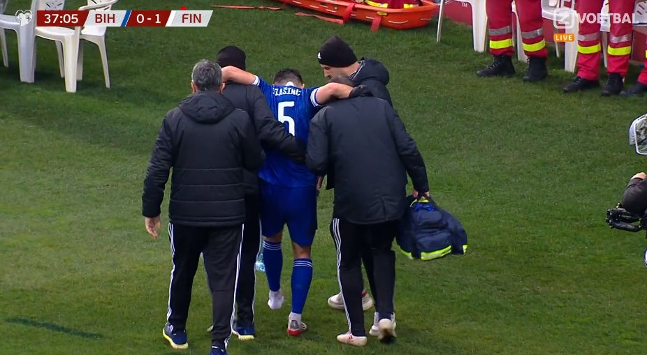 Sead Kolasinac being aided off the pitch (Photo via Football24/7 on Twitter)