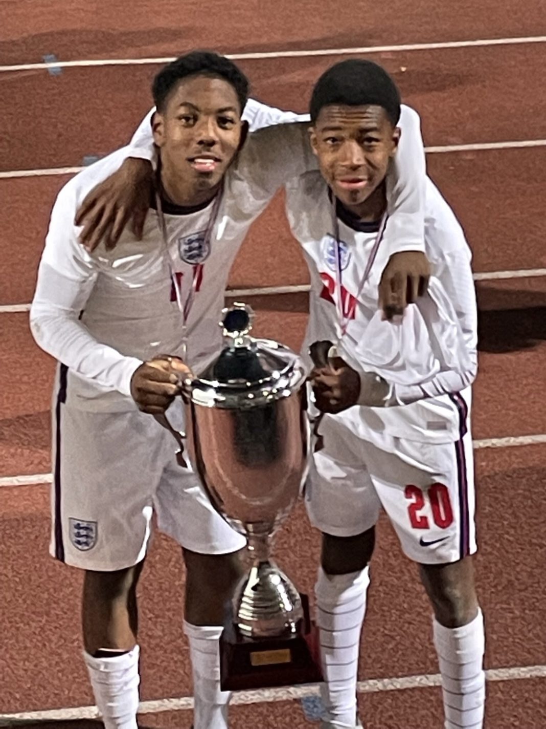 Myles Lewis-Skelly (L) with the Val de Marne Tournament trophy