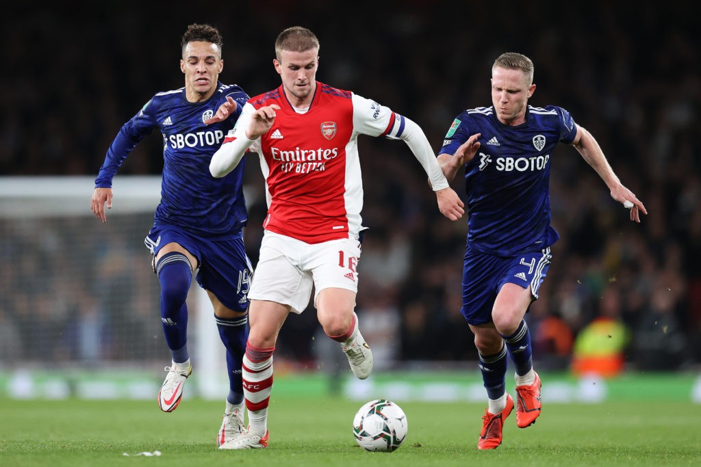 LONDON, ENGLAND: Rob Holding of Arsenal is challenged by Rodrigo Moreno and Adam Forshaw of Leeds United during the Carabao Cup Round of 16 match between Arsenal and Leeds United at Emirates Stadium on October 26, 2021. (Photo by Alex Pantling/Getty Images)