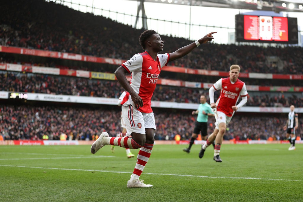 LONDON, ENGLAND: Bukayo Saka of Arsenal celebrates after scoring the team's first goal during the Premier League match between Arsenal and Newcastle United at Emirates Stadium on November 27, 2021. (Photo by Richard Heathcote / Getty Images)