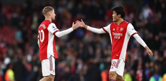 LONDON, ENGLAND - NOVEMBER 07: Emile Smith Rowe and Takehiro Tomiyasu of Arsenal shake hands after the Premier League match between Arsenal and Watford at Emirates Stadium on November 07, 2021 in London, England. (Photo by Ryan Pierse/Getty Images)
