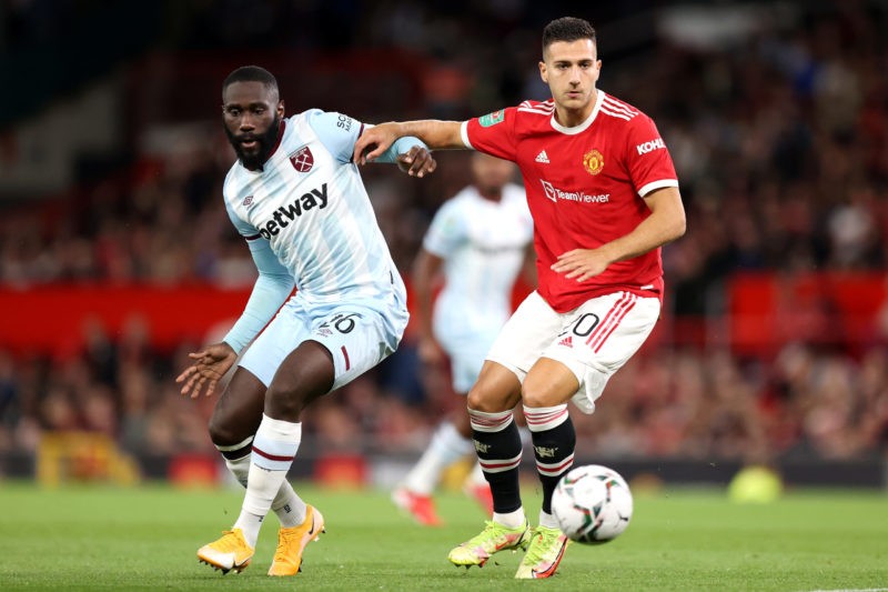 MANCHESTER, ENGLAND - SEPTEMBER 22: Diogo Dalot of Manchester United battles for possession with Arthur Masuaku of West Ham United during the Carabao Cup Third Round match between Manchester United and West Ham United at Old Trafford on September 22, 2021 in Manchester, England. (Photo by Alex Pantling/Getty Images)