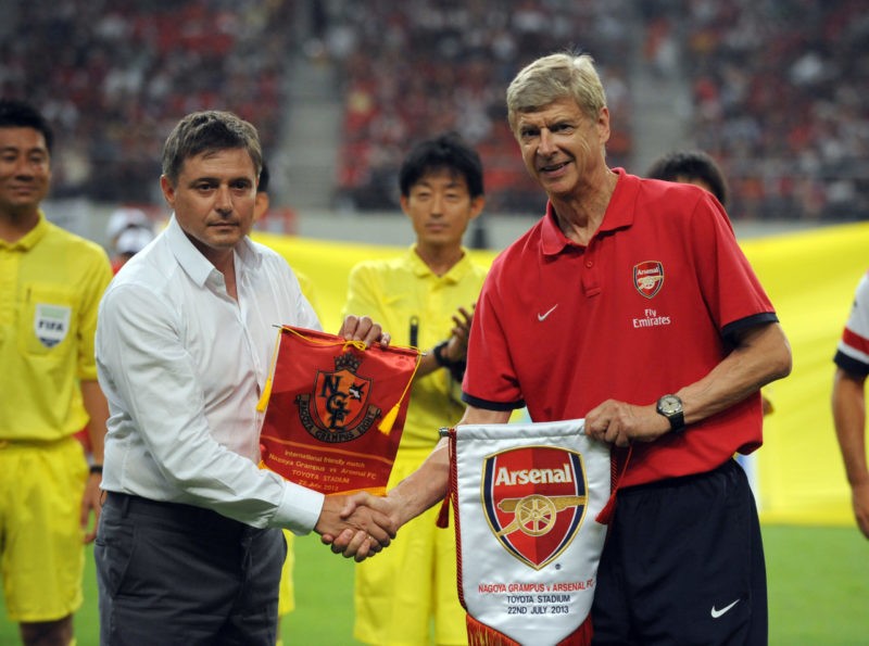 TOYOTA, JAPAN - JULY 22: Arsene Wenger, coach of Arsenal (R) and Dragan Stojkovic, coach of Nagoya Grampus shake hands prior to the pre-season friendly match between Nagoya Grampus and Arsenal at Toyota Stadium on July 22, 2013 in Toyota, Aichi, Japan. (Photo by Masashi Hara/Getty Images)