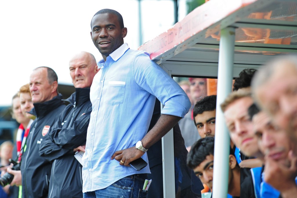 BARNET, ENGLAND: Fabrice Muamba, manager of World Refugee Internally Displaced Persons (IDP) XI looks on from the dugout during the charity football match between Arsenal Legends XI and World Refugee Internally Displaced Persons (IDP) XI at Underhill Stadium on June 23, 2013. (Photo by Alex Broadway / Getty Images)