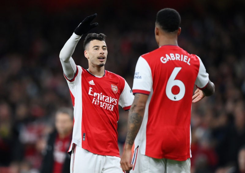 LONDON, ENGLAND - DECEMBER 15: Gabriel Martinelli celebrates with teammate Gabriel Magalhaes of Arsenal after scoring their team's first goal during the Premier League match between Arsenal and West Ham United at Emirates Stadium on December 15, 2021 in London, England. (Photo by Justin Setterfield/Getty Images)