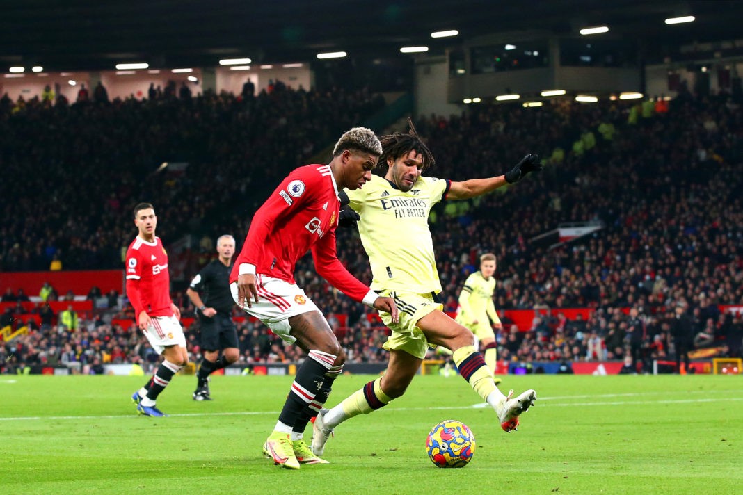MANCHESTER, ENGLAND - DECEMBER 02: Marcus Rashford of Manchester United battles for possession with Mohamed Elneny of Arsenal during the Premier League match between Manchester United and Arsenal at Old Trafford on December 02, 2021 in Manchester, England. (Photo by Alex Livesey/Getty Images)
