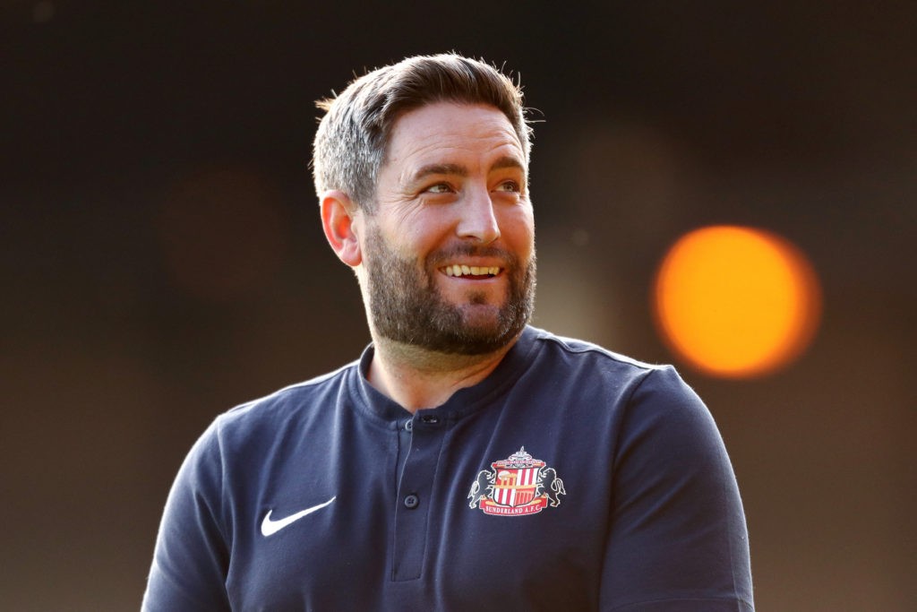 BURSLEM, ENGLAND: Lee Johnson, Head Coach of Sunderland reacts as he inspects the pitch prior to the Carabao Cup First Round match between Port Vale and Sunderland at Vale Park on August 10, 2021. (Photo by Lewis Storey / Getty Images)