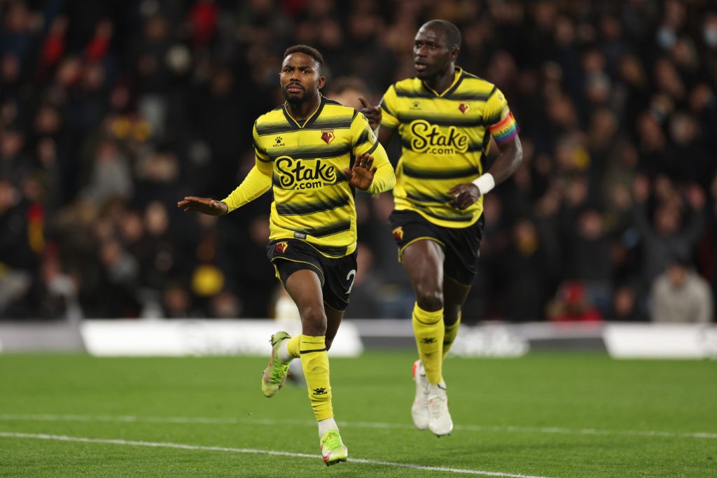 WATFORD, ENGLAND: Emmanuel Dennis of Watford FC celebrates after scoring their side's first goal during the Premier League match between Watford and Chelsea at Vicarage Road on December 01, 2021. (Photo by Richard Heathcote/Getty Images)