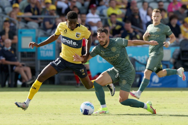 GOSFORD, AUSTRALIA - JANUARY 23: Carl Jenkinson of Melbourne City is contested by Beni Nkololo during the round 11 A-League match between Central Coast Mariners and Melbourne City at Central Coast Stadium, on January 23, 2022, in Gosford, Australia. (Photo by Ashley Feder/Getty Images)